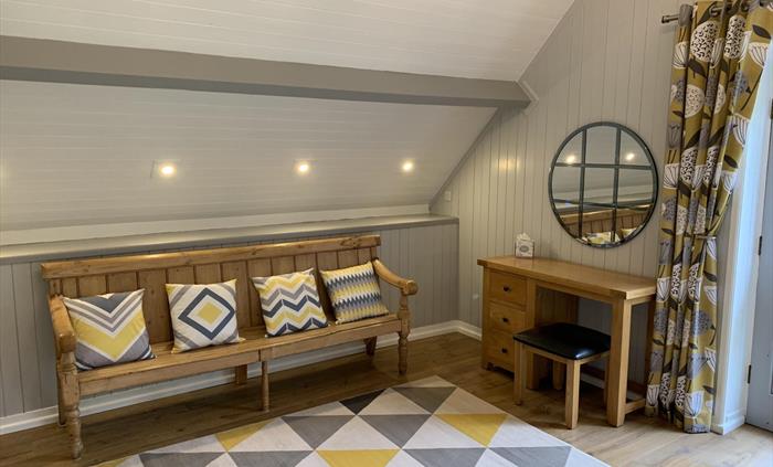 Hilltops Brecon Holiday Cottages - The Longhouse main bedroom with dressing table, separate dressing area and en-suite